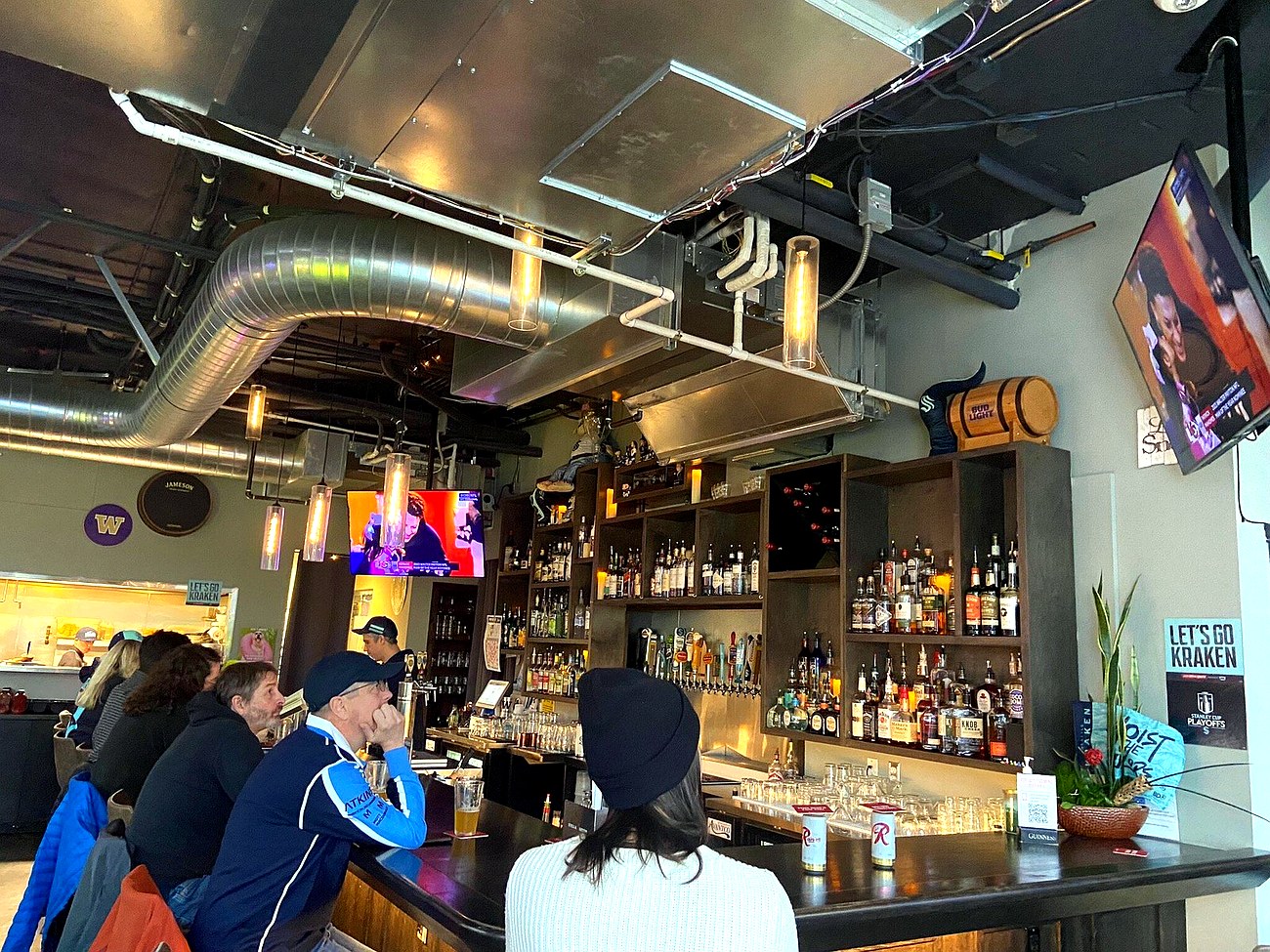 Big screens showing the game at Cairde Public House near Climate Pledge Arena